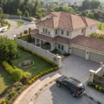 Pakistani family home with car parked outside, showing house property assets, aerial view landscape composition, sunny daylig